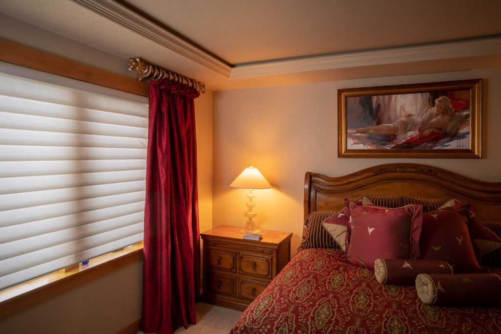red silk drapery panel in master bedroom